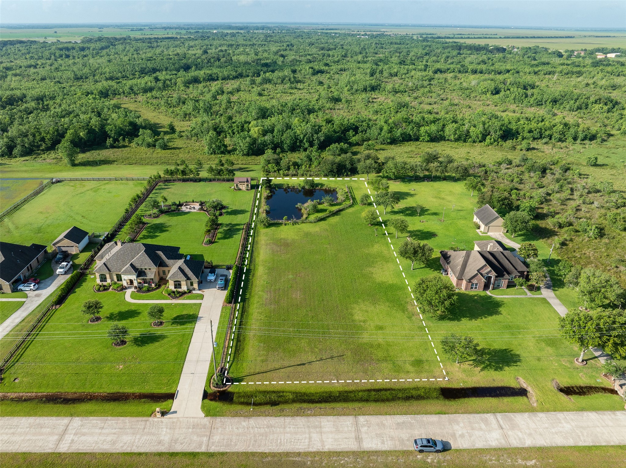 7706 Pebble Hill Lane Rosharon, TX 77583 - Photo 2 of 16 an aerial view of a golf course with a big yard