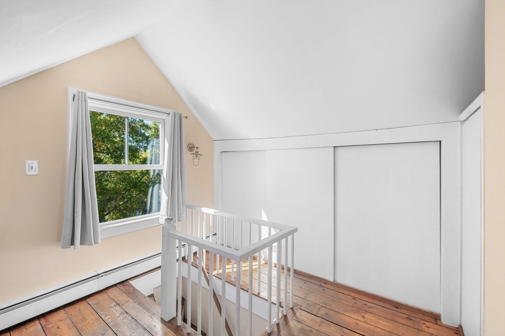 2 Lindsey Street Marblehead, MA 01945 - Photo 18 of 19 a view of an empty room with wooden floor and a window