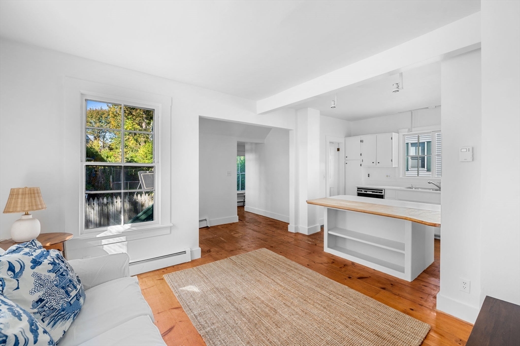 2 Lindsey Street Marblehead, MA 01945 - Photo 6 of 19 a view of a bedroom with wooden floor and a window