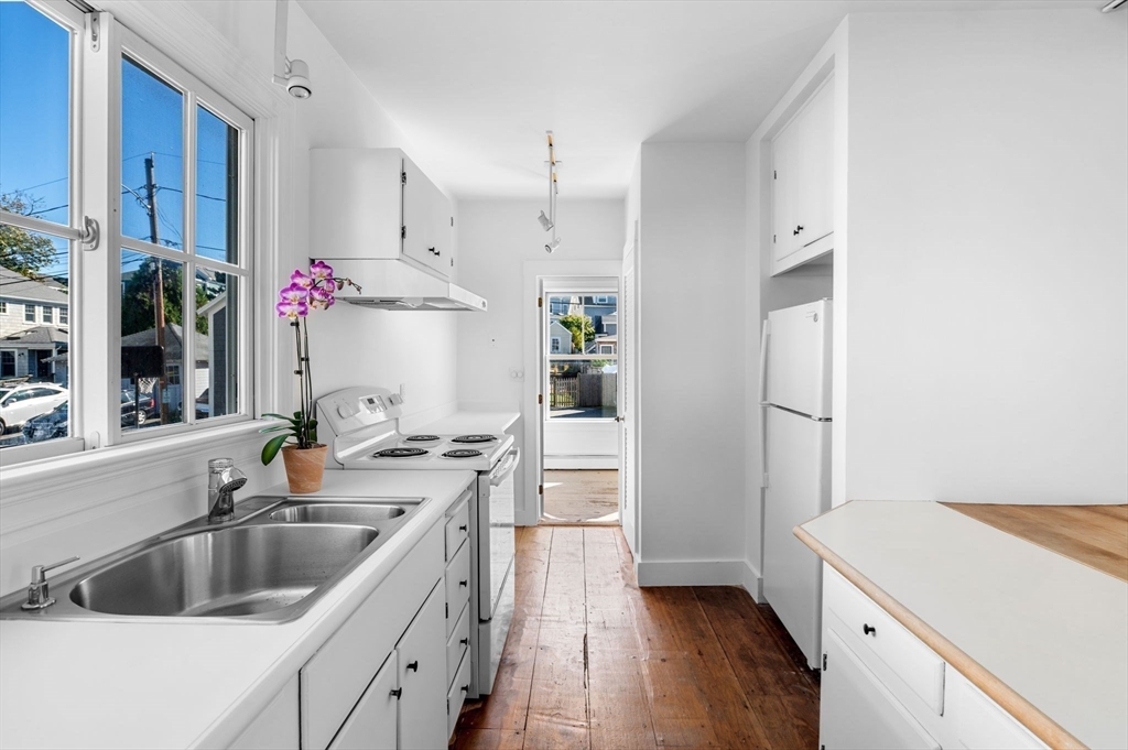 2 Lindsey Street Marblehead, MA 01945 - Photo 8 of 19 a kitchen with a sink stove top oven and refrigerator