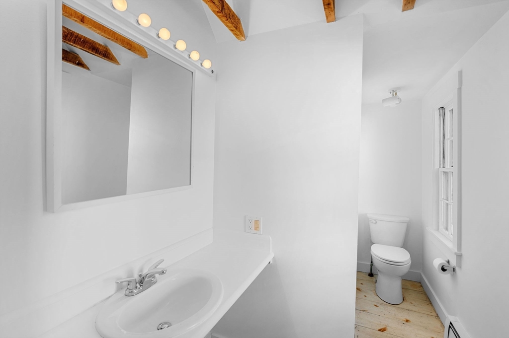 2 Lindsey Street Marblehead, MA 01945 - Photo 9 of 19 a bathroom with a sink a toilet and shower