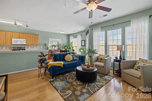a living room with furniture and a large window