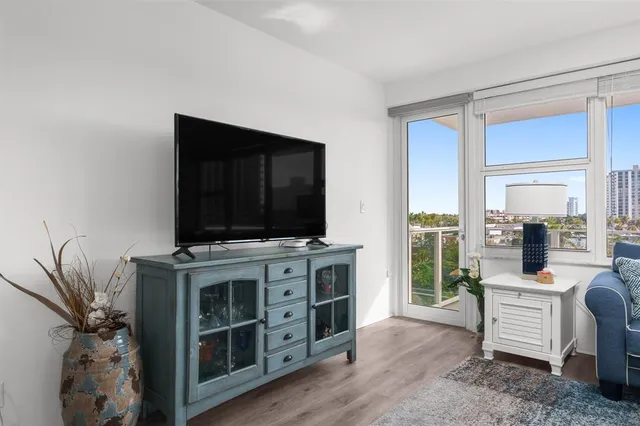 a kitchen with granite countertop cabinets and window