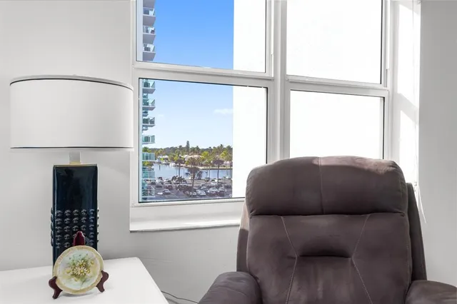 a kitchen with white cabinets and appliances