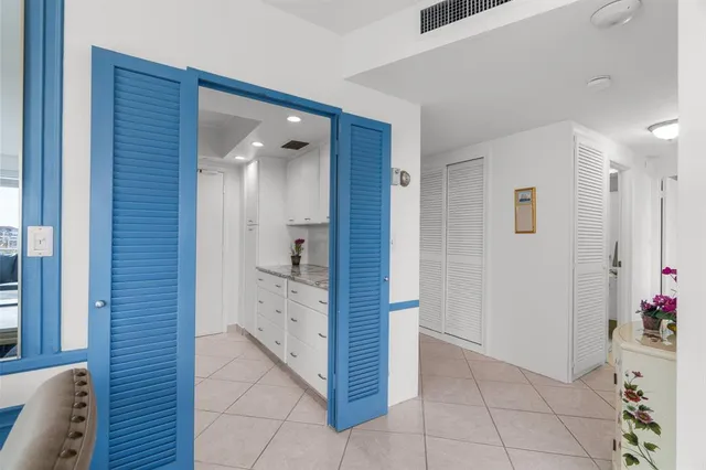 a kitchen with cabinets stainless steel appliances and a sink