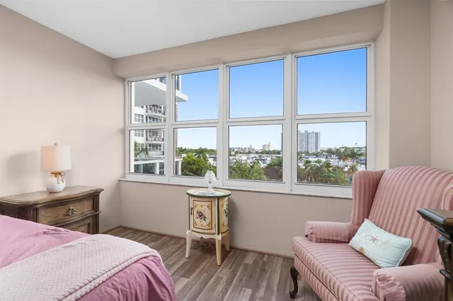 a view of a balcony with a floor to ceiling window next to a yard