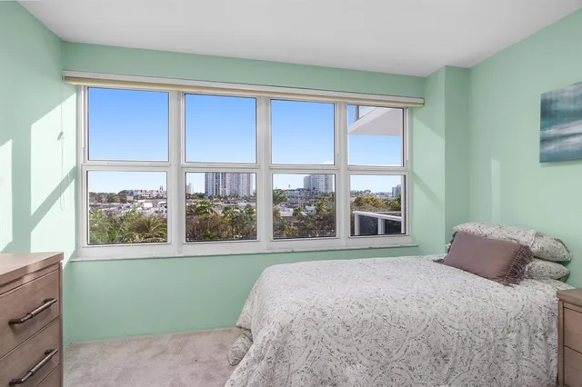 a view of a balcony with a lake view and wooden floor