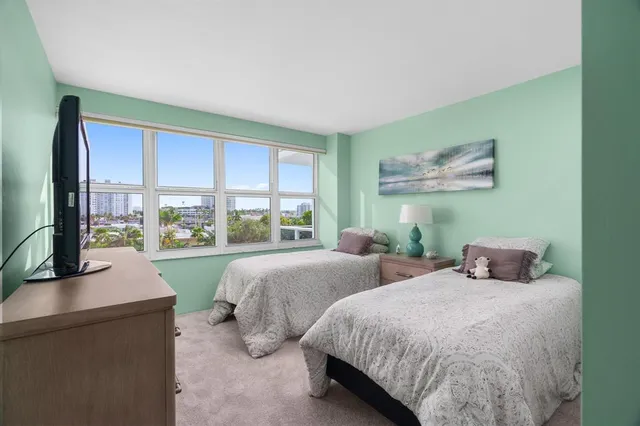 a balcony with table and chairs