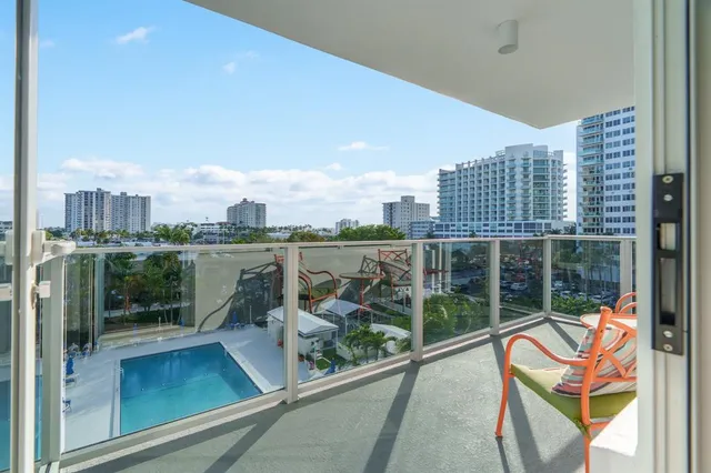 a view of a swimming pool with a deck
