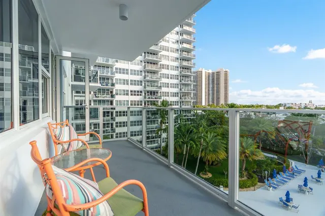 a view of swimming pool with outdoor seating