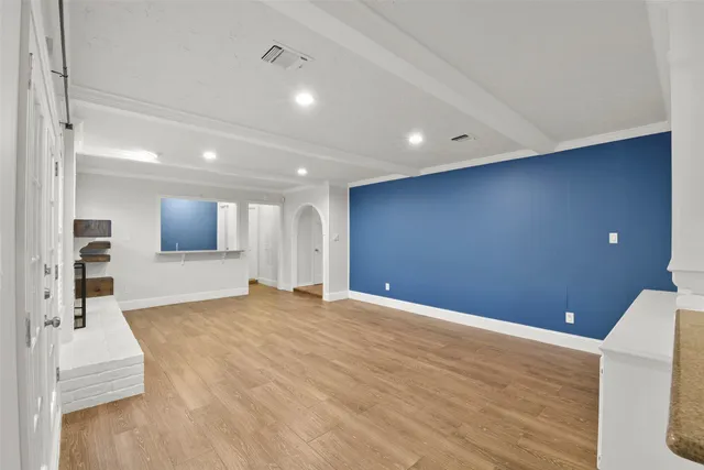 a view of a livingroom with wooden floor