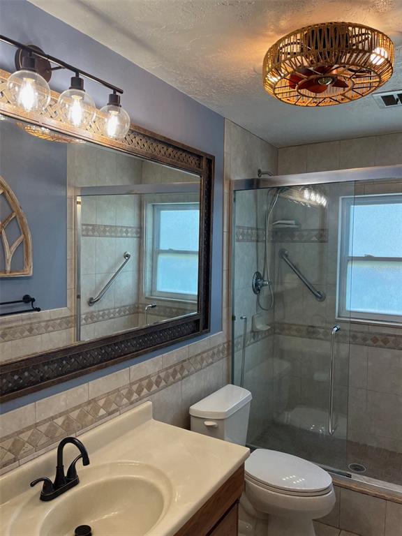 8372 Candlewood Road Seminole, FL 33777 - Photo 9 of 13 a bathroom with a sink and a mirror