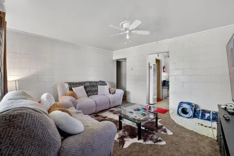 a bedroom with furniture and a chandelier