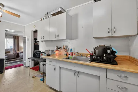 a kitchen with a sink cabinets and appliances