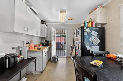 a kitchen view of counter top space a sink and appliances