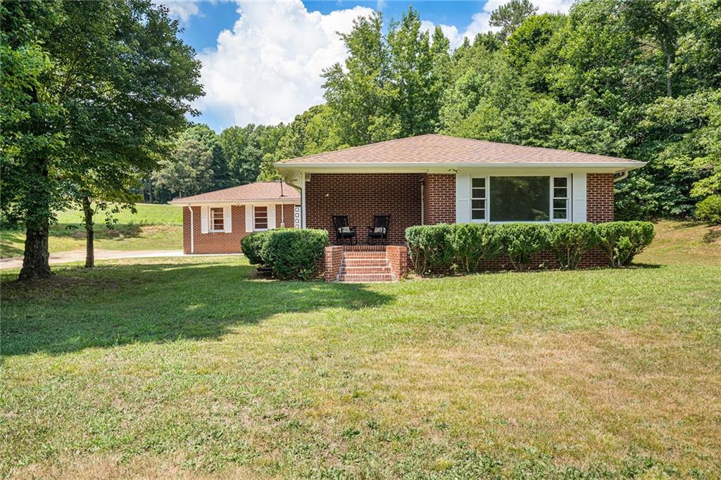 4569 Nopone Road Gainesville, GA 30506 - Photo 1 of 1 a front view of a house with garden