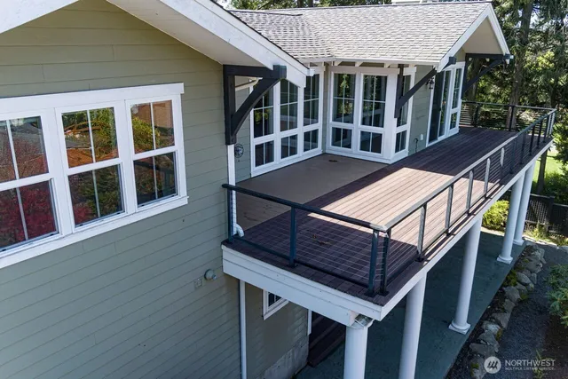 a view of balcony with wooden floor and fence