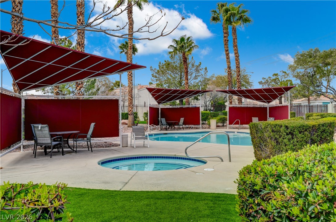 7885 West Flamingo Road, Unit 1050 Las Vegas, NV 89147 - Photo 53 of 62 An inviting pool area with shaded seating provides an ideal setting for relaxation.