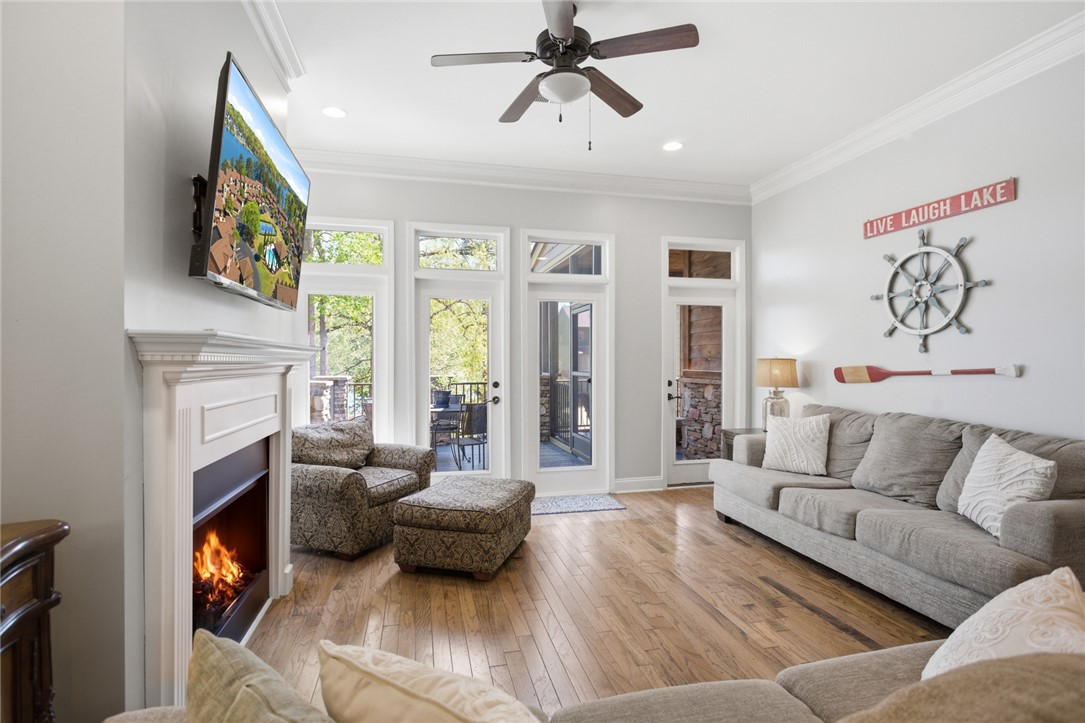 578 Sunset Point Drive West Union, SC 29696 - Photo 7 of 46 This inviting living space features an elegant fireplace, rich hardwood flooring, and abundant natural light.
