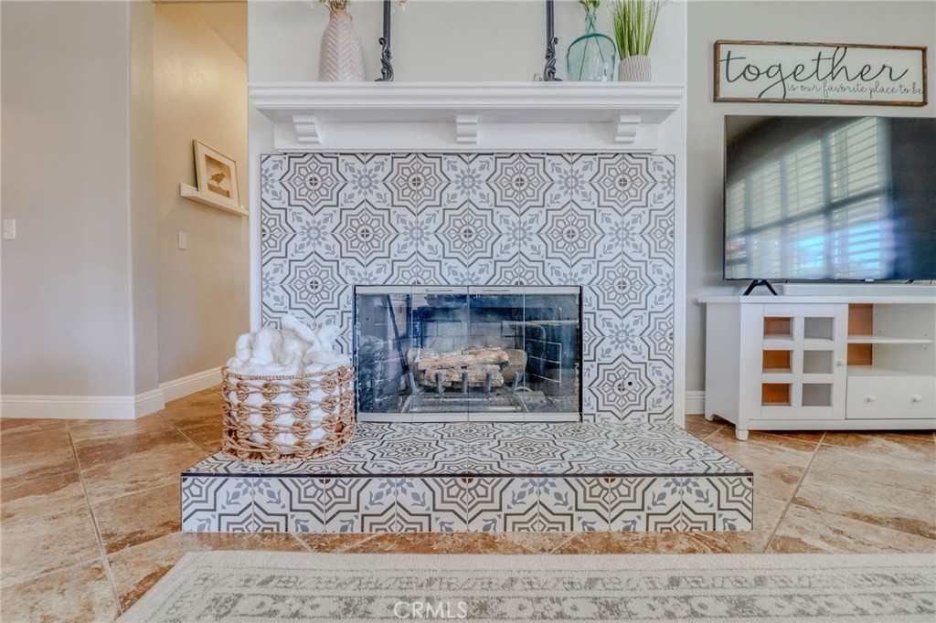 729 Windbound Avenue Beaumont, CA 92223 - Photo 30 of 73 a fireplace with wooden floor