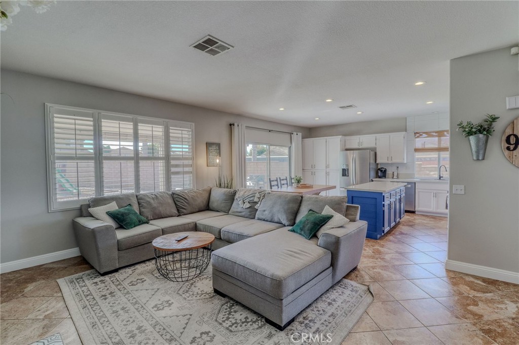 729 Windbound Avenue Beaumont, CA 92223 - Photo 31 of 73 a living room with furniture and a large window