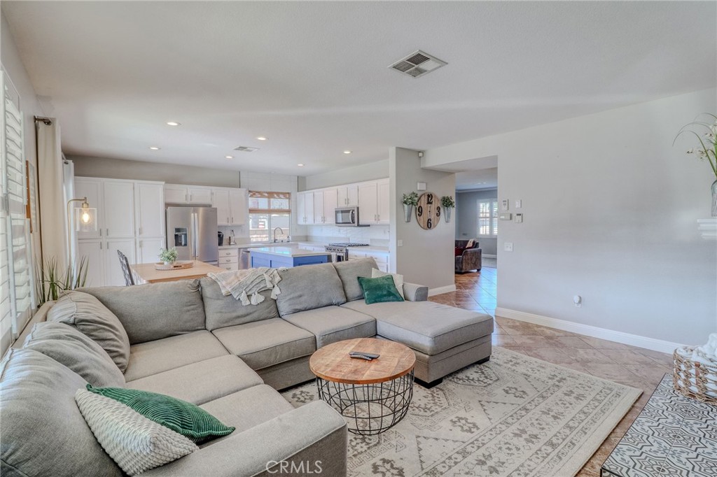 729 Windbound Avenue Beaumont, CA 92223 - Photo 33 of 73 a living room with furniture and a rug