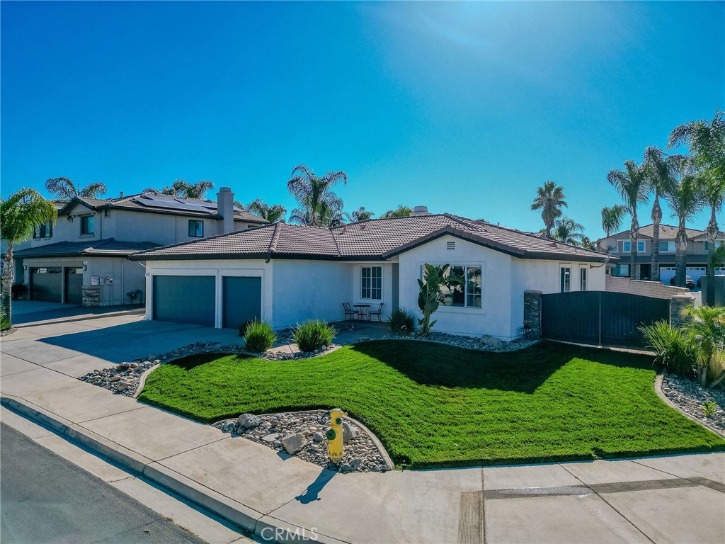 729 Windbound Avenue Beaumont, CA 92223 - Photo 4 of 73 a front view of a house with a yard and garage