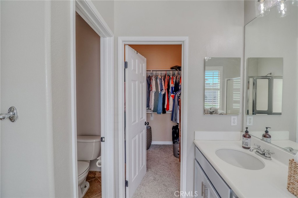 729 Windbound Avenue Beaumont, CA 92223 - Photo 41 of 73 a bathroom with a sink vanity and a mirror