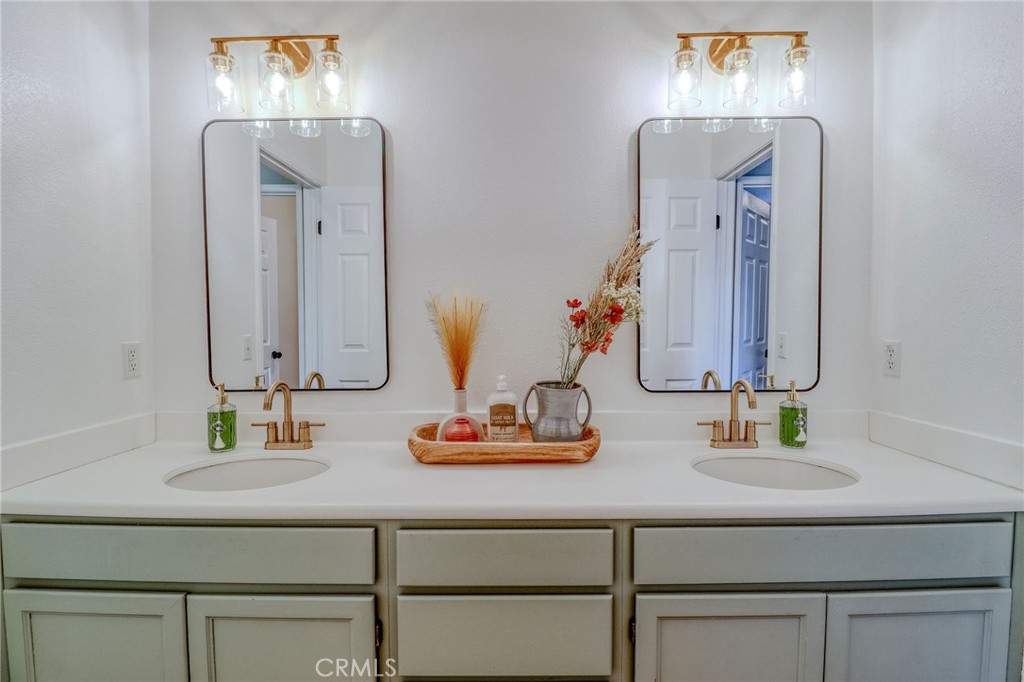 729 Windbound Avenue Beaumont, CA 92223 - Photo 45 of 73 a bathroom with double vanity sinks and a mirror