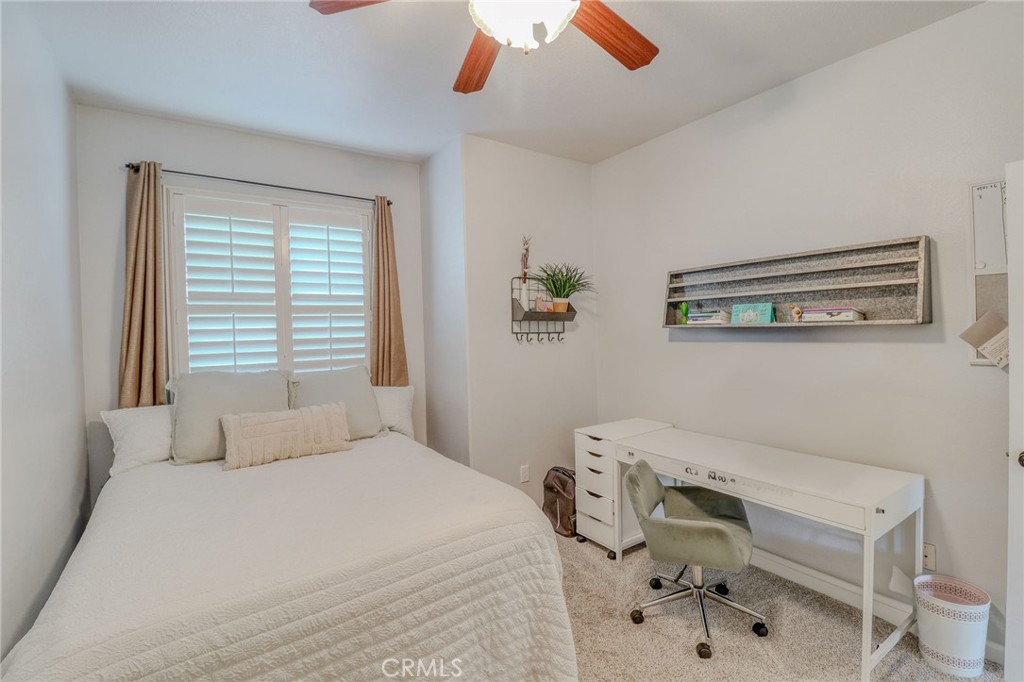 729 Windbound Avenue Beaumont, CA 92223 - Photo 46 of 73 a bedroom with a bed and a chair