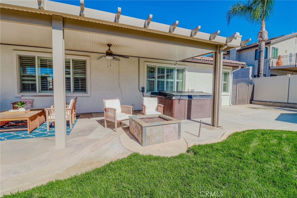 729 Windbound Avenue Beaumont, CA 92223 - Photo 57 of 73 a view of a patio with couches table and chairs and potted plants