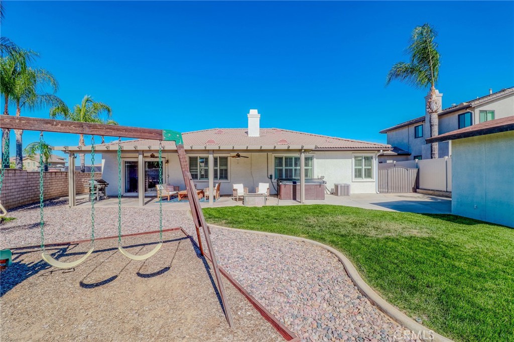 729 Windbound Avenue Beaumont, CA 92223 - Photo 68 of 73 a view of a house with backyard sitting area and garden