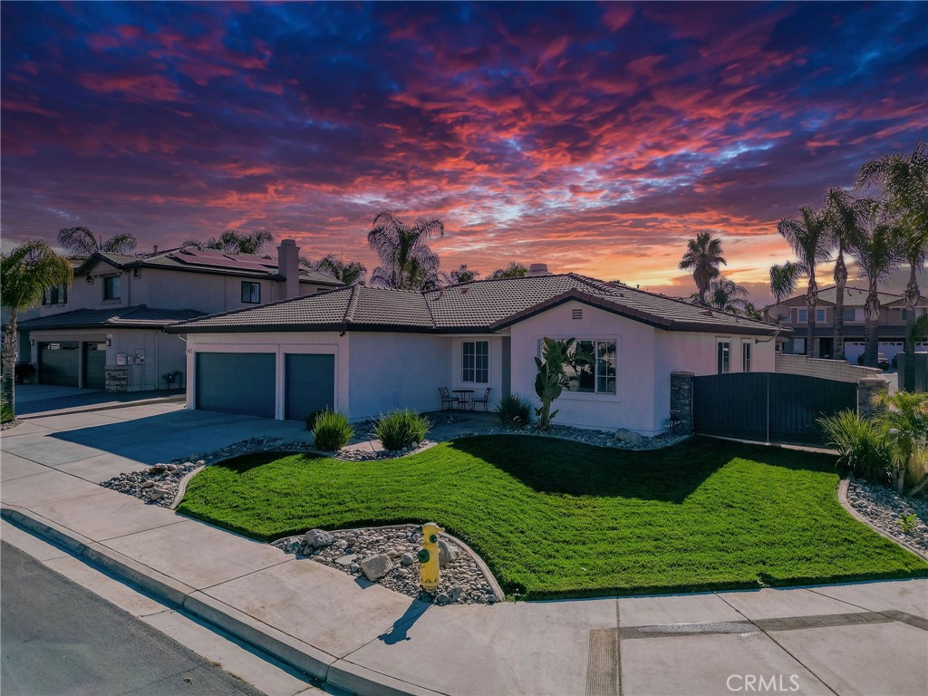 729 Windbound Avenue Beaumont, CA 92223 - Photo 8 of 73 a view of a yard in front of a house with a large tree