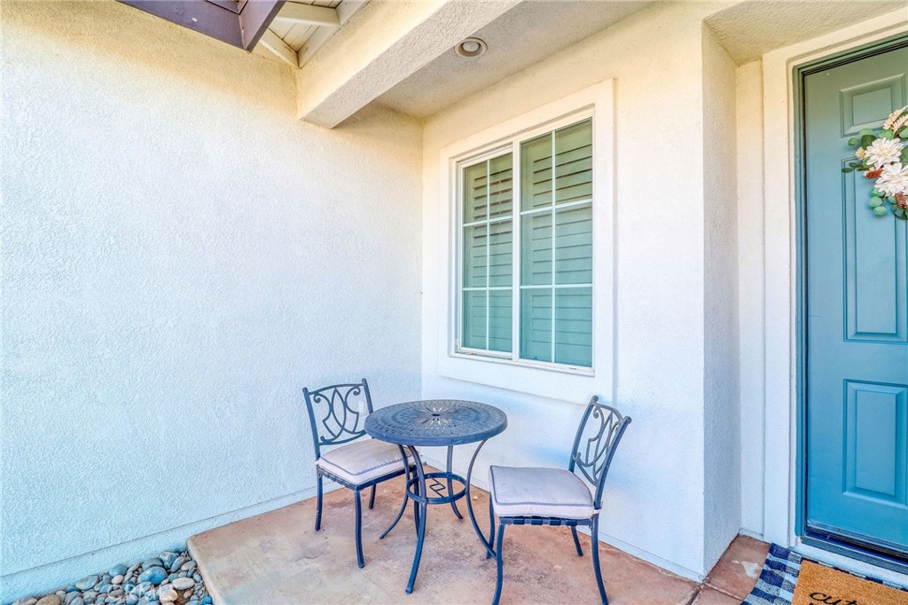 729 Windbound Avenue Beaumont, CA 92223 - Photo 9 of 73 a view of a room that has a table and chair