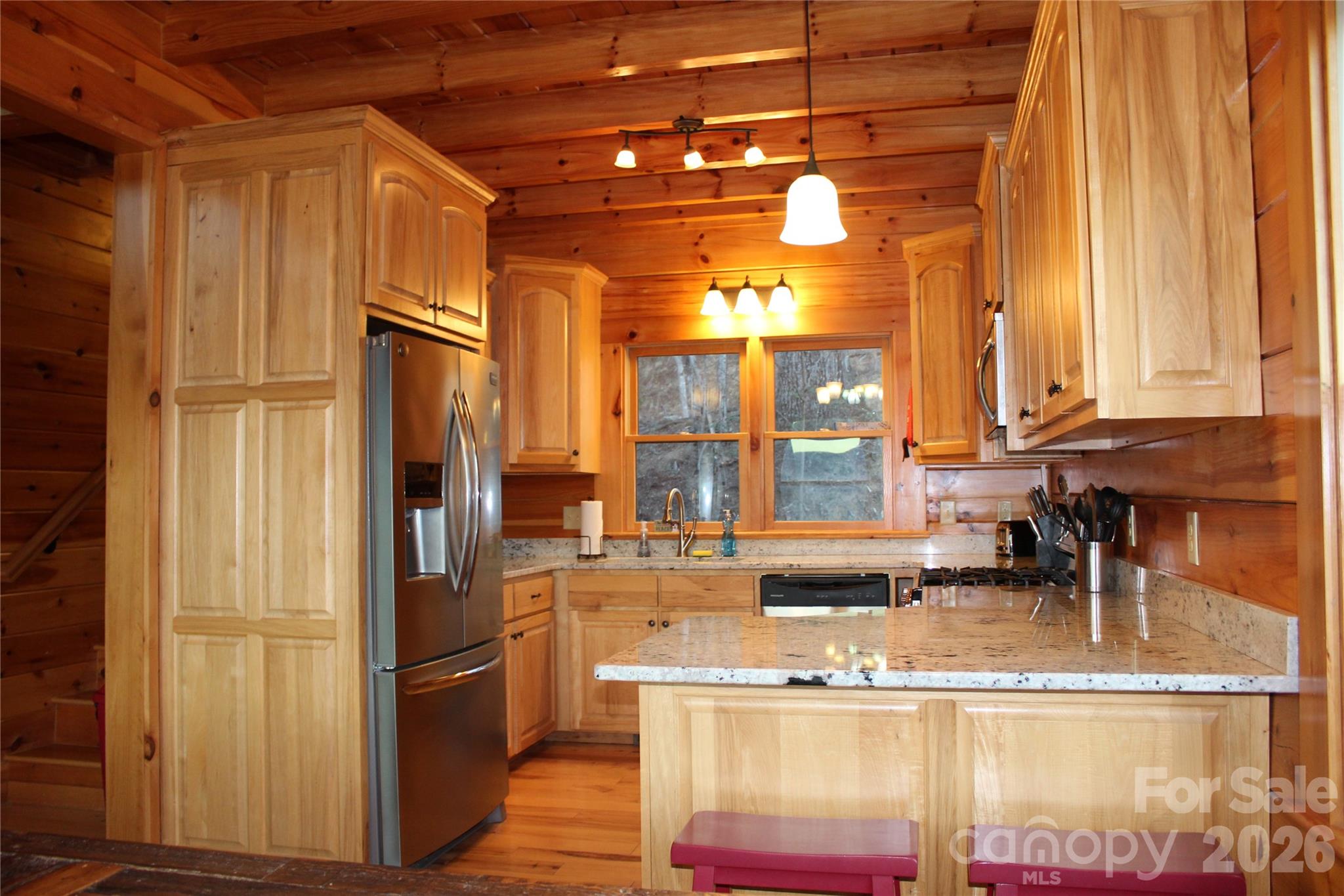 169 Overlook Point Lane Lake Lure, NC 28746 - Photo 15 of 39 a kitchen with stainless steel appliances granite countertop a refrigerator a oven and a stove