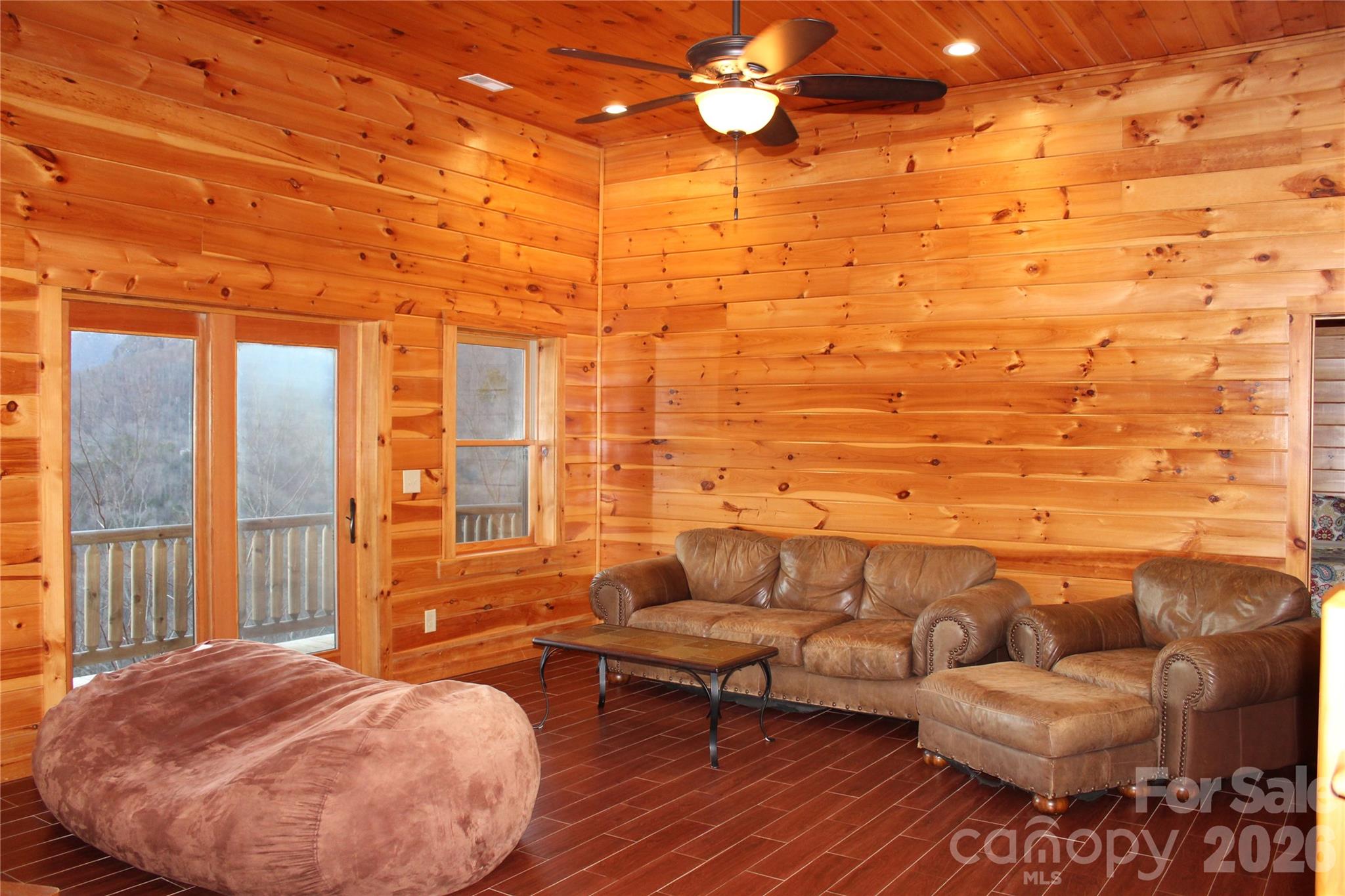 169 Overlook Point Lane Lake Lure, NC 28746 - Photo 33 of 39 a living room with furniture and a large window