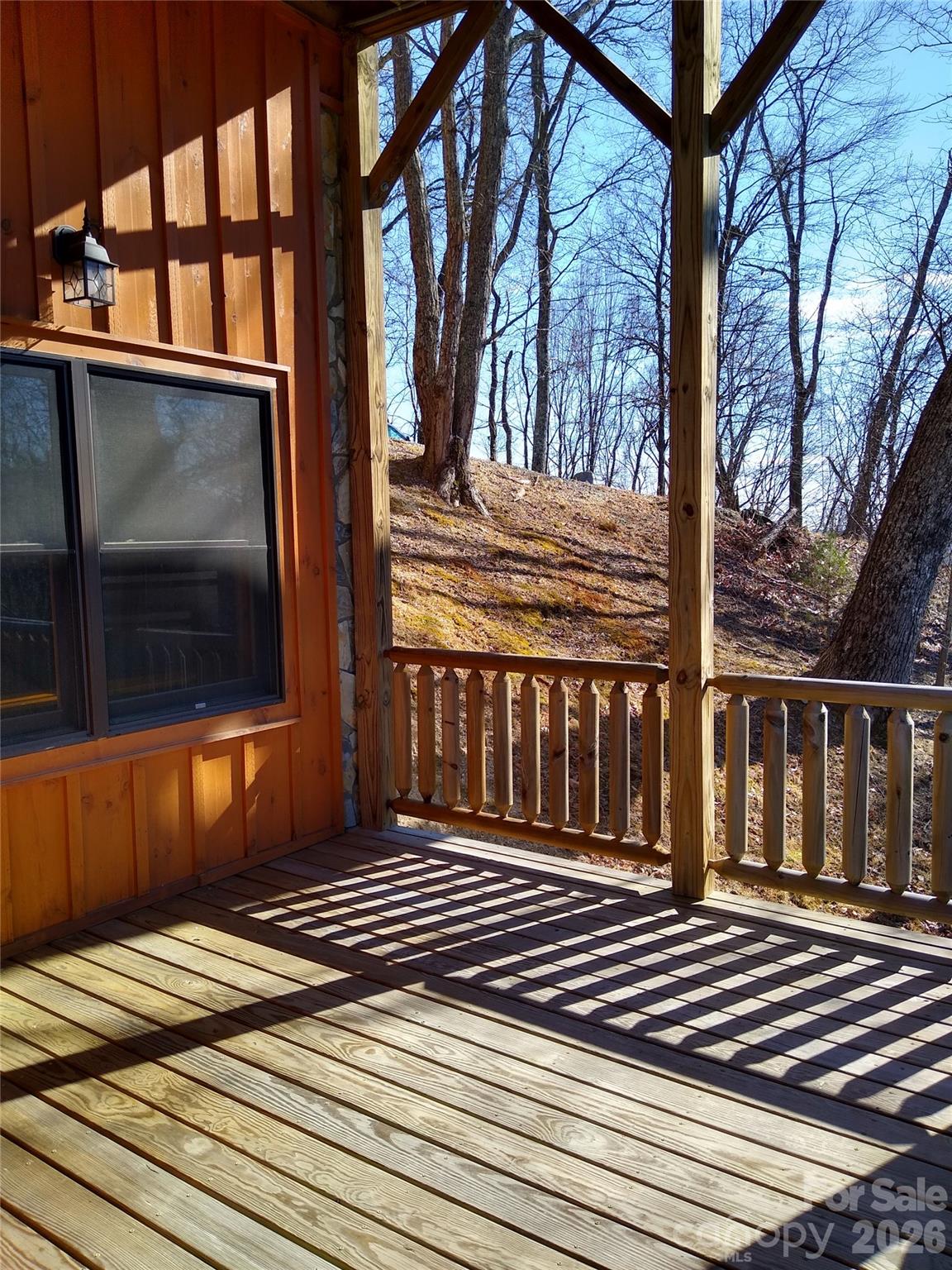 169 Overlook Point Lane Lake Lure, NC 28746 - Photo 37 of 39 a view of a house with a door and wooden floor