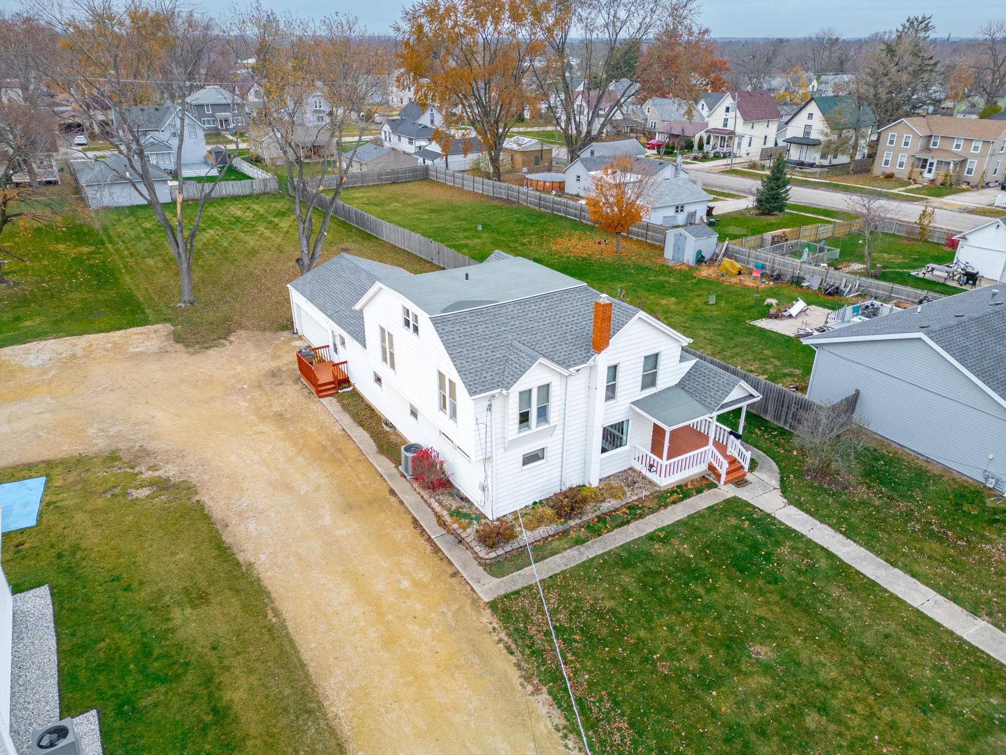 1111 Pearl Street Belvidere, IL 61008 - Photo 1 of 40 an aerial view of a house with a garden and trees