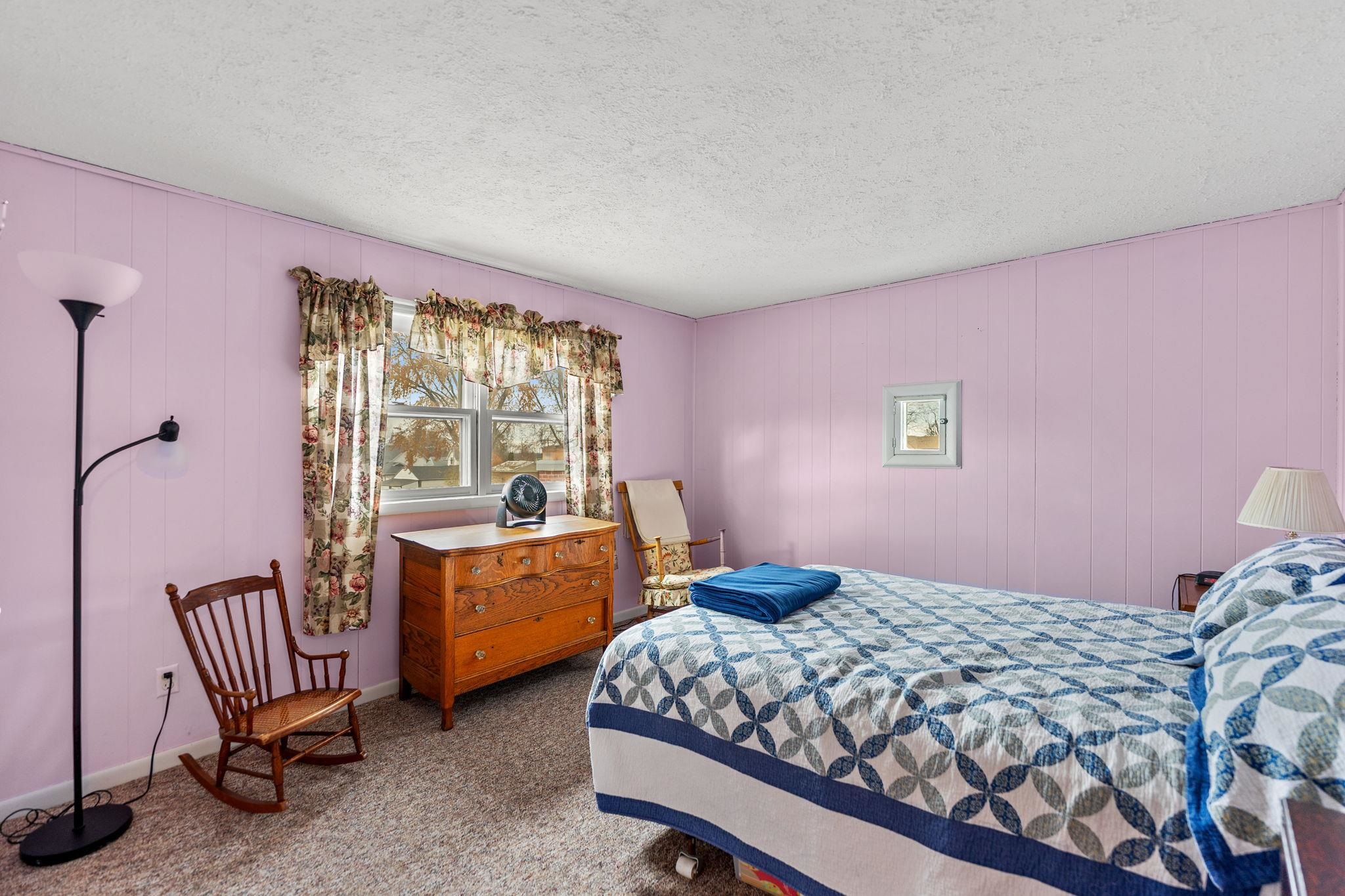 1111 Pearl Street Belvidere, IL 61008 - Photo 11 of 40 a bedroom with a bed and a window