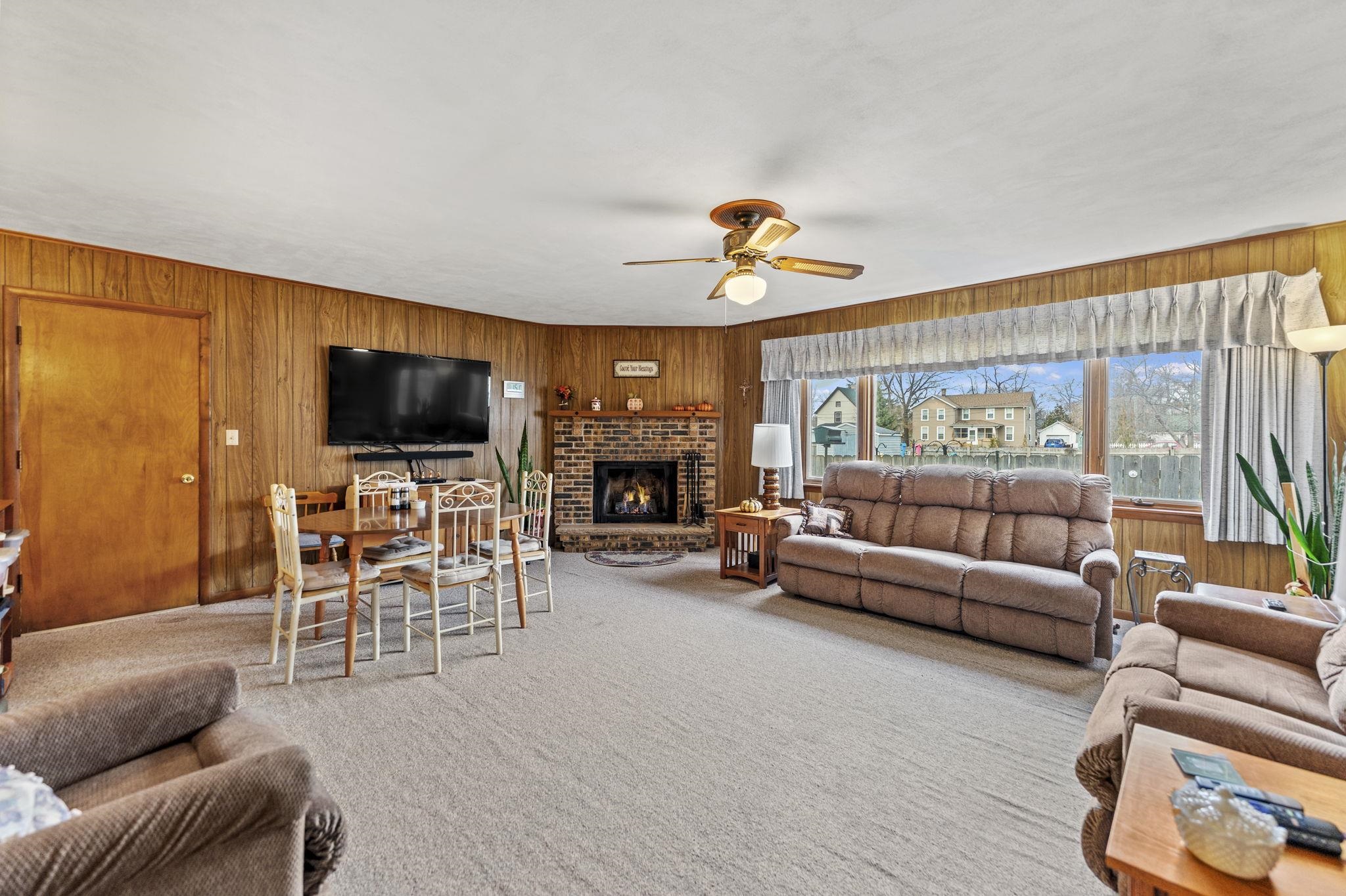 1111 Pearl Street Belvidere, IL 61008 - Photo 22 of 40 a living room with furniture and a flat screen tv