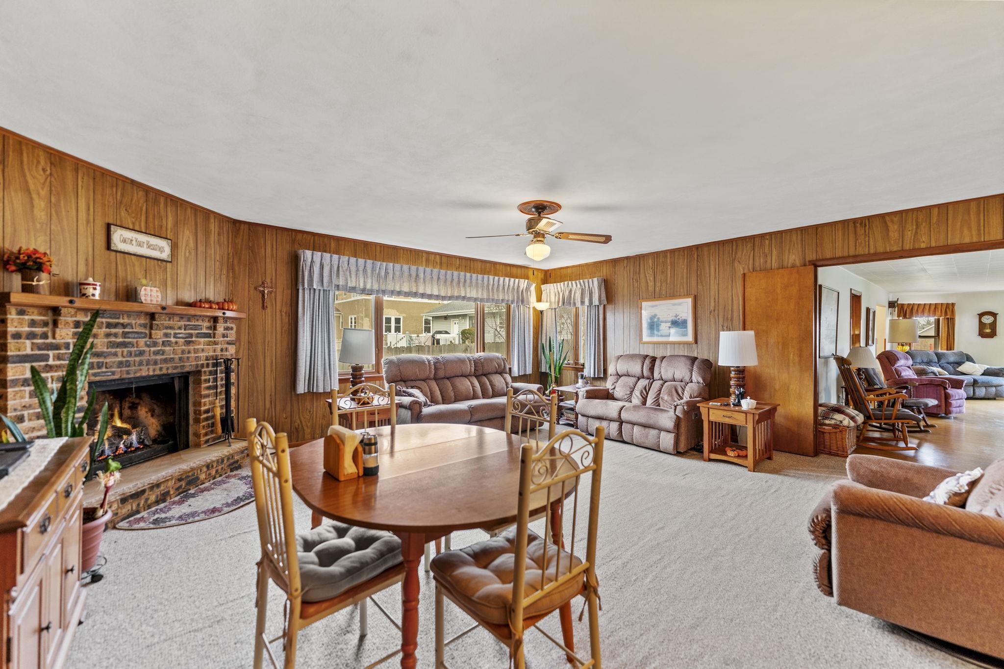 1111 Pearl Street Belvidere, IL 61008 - Photo 23 of 40 a dining room with furniture fireplace and a chandelier