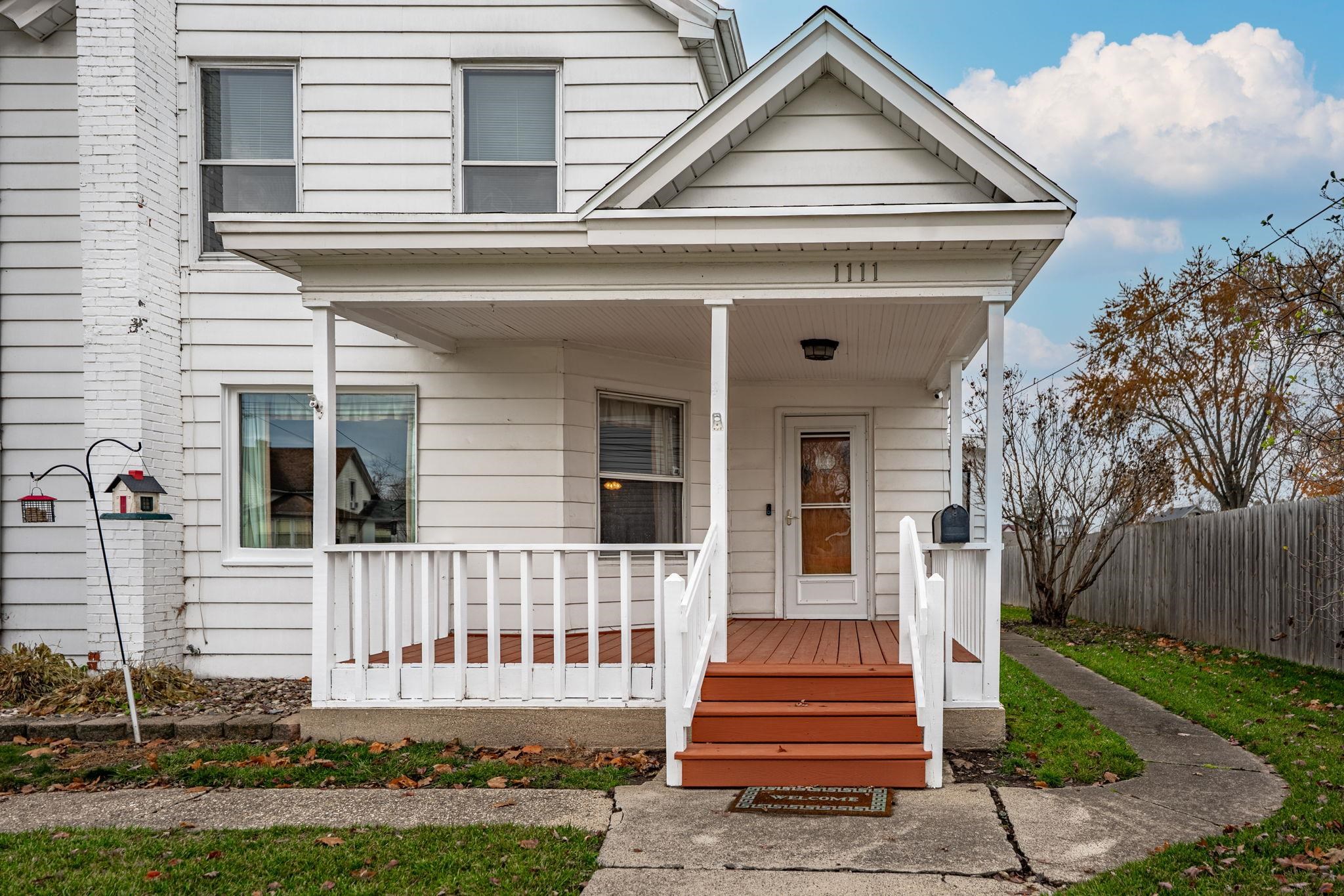 1111 Pearl Street Belvidere, IL 61008 - Photo 5 of 40 a front view of a house with a yard