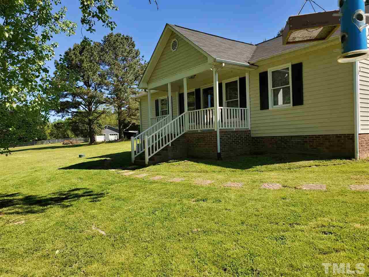 7018 Kiger Road Rougemont, NC 27572 - Photo 1 of 3 a front view of a house with a yard