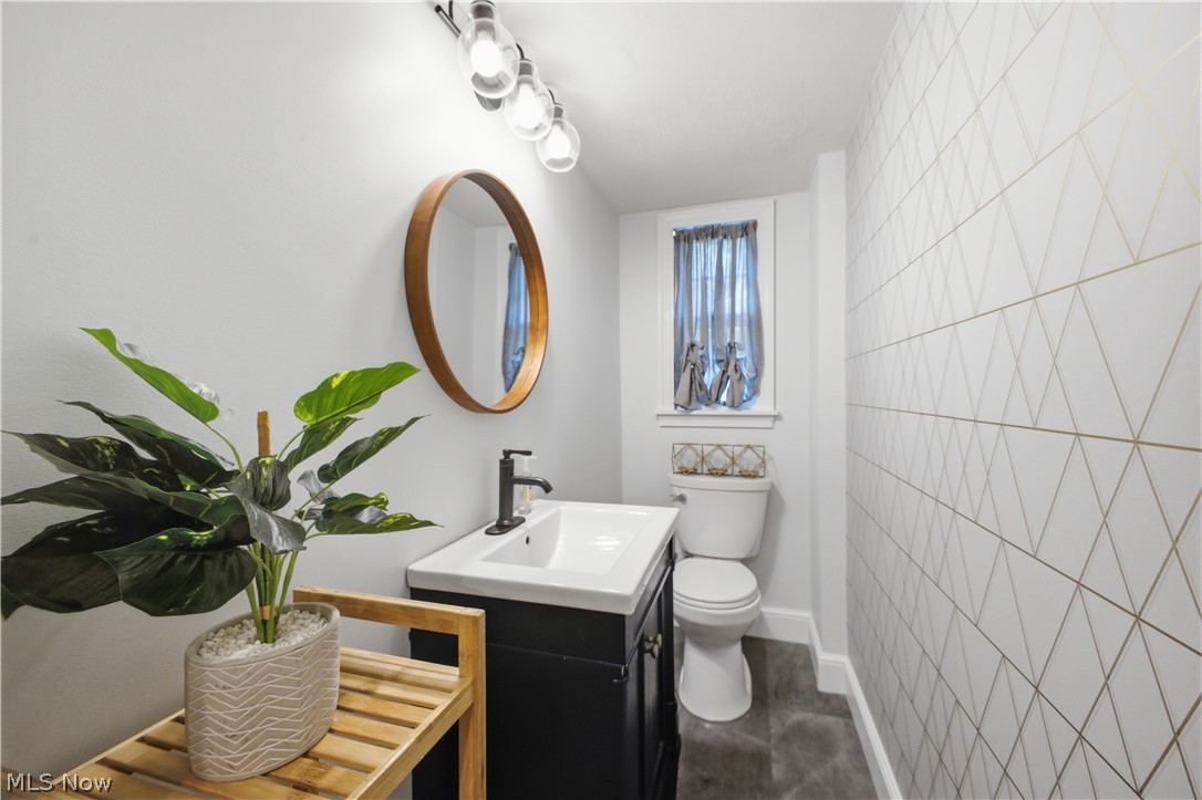 2411 Ridgeview Lane Youngstown, OH 44514 - Photo 17 of 48 Compact bathroom featuring a contemporary vanity with a white basin and matte black faucet