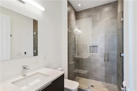 a bathroom with a glass shower door