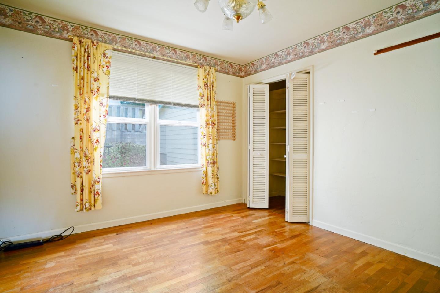 305 Stuart Avenue Pacific Grove, CA 93950 - Photo 14 of 24 a view of an empty room with a window