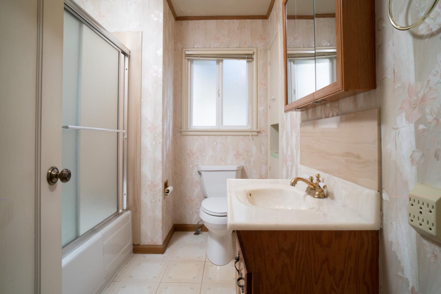 305 Stuart Avenue Pacific Grove, CA 93950 - Photo 15 of 24 a bathroom with a sink toilet and shower