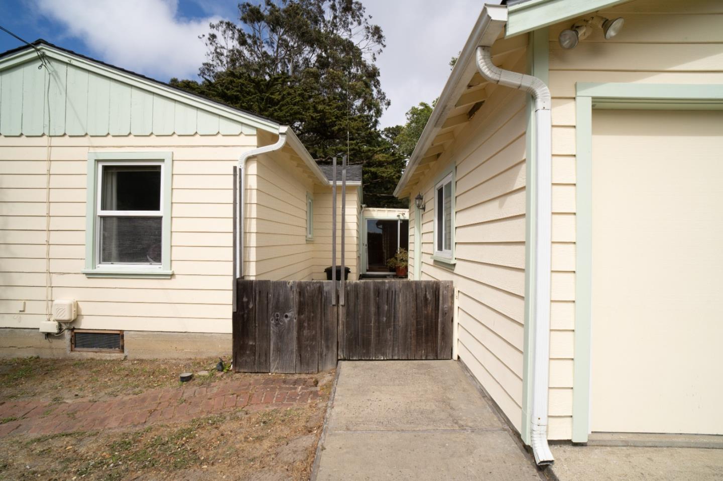 305 Stuart Avenue Pacific Grove, CA 93950 - Photo 17 of 24 a view of house with wooden fence
