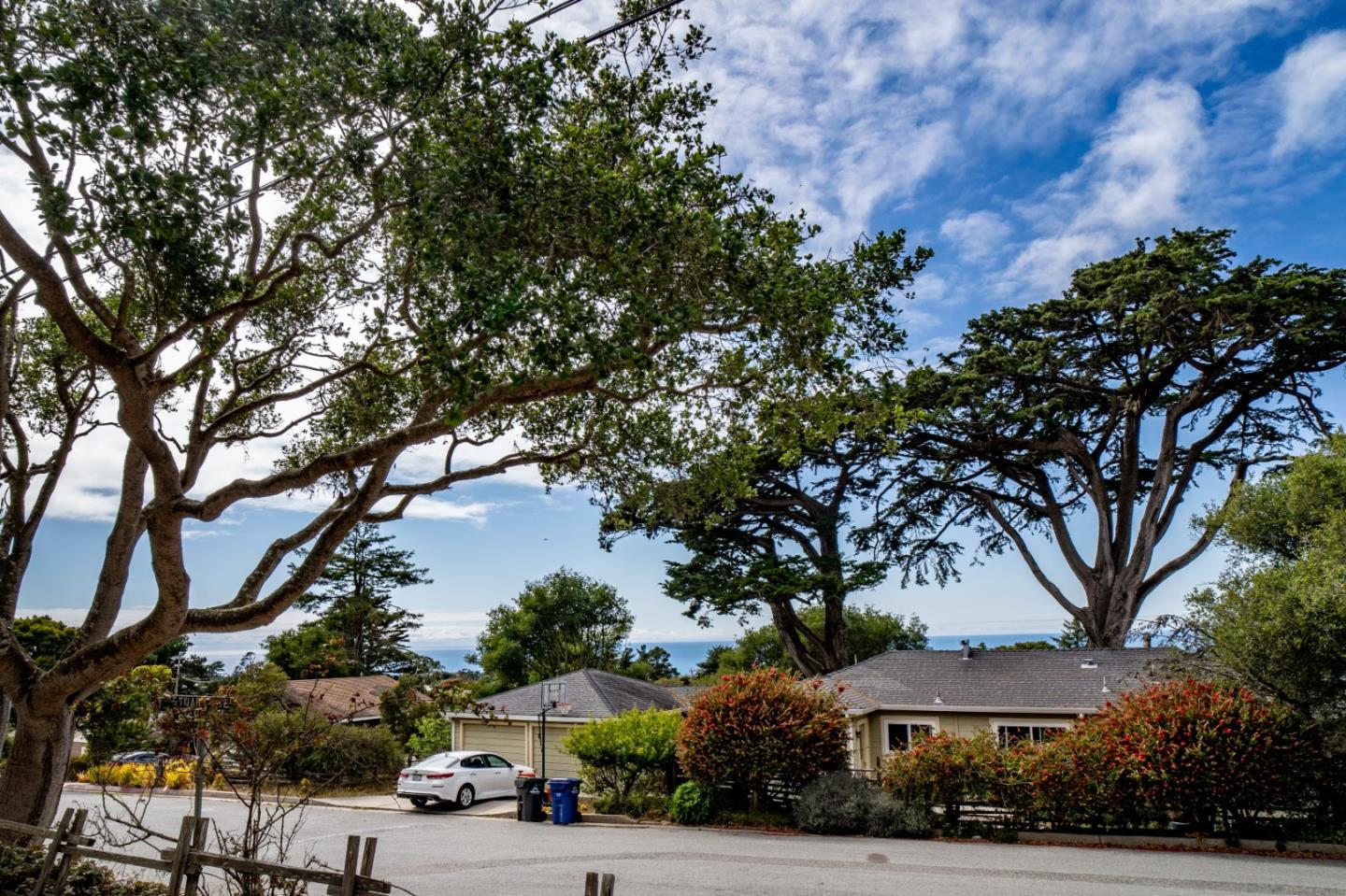 305 Stuart Avenue Pacific Grove, CA 93950 - Photo 2 of 24 a street view with residential house and green space