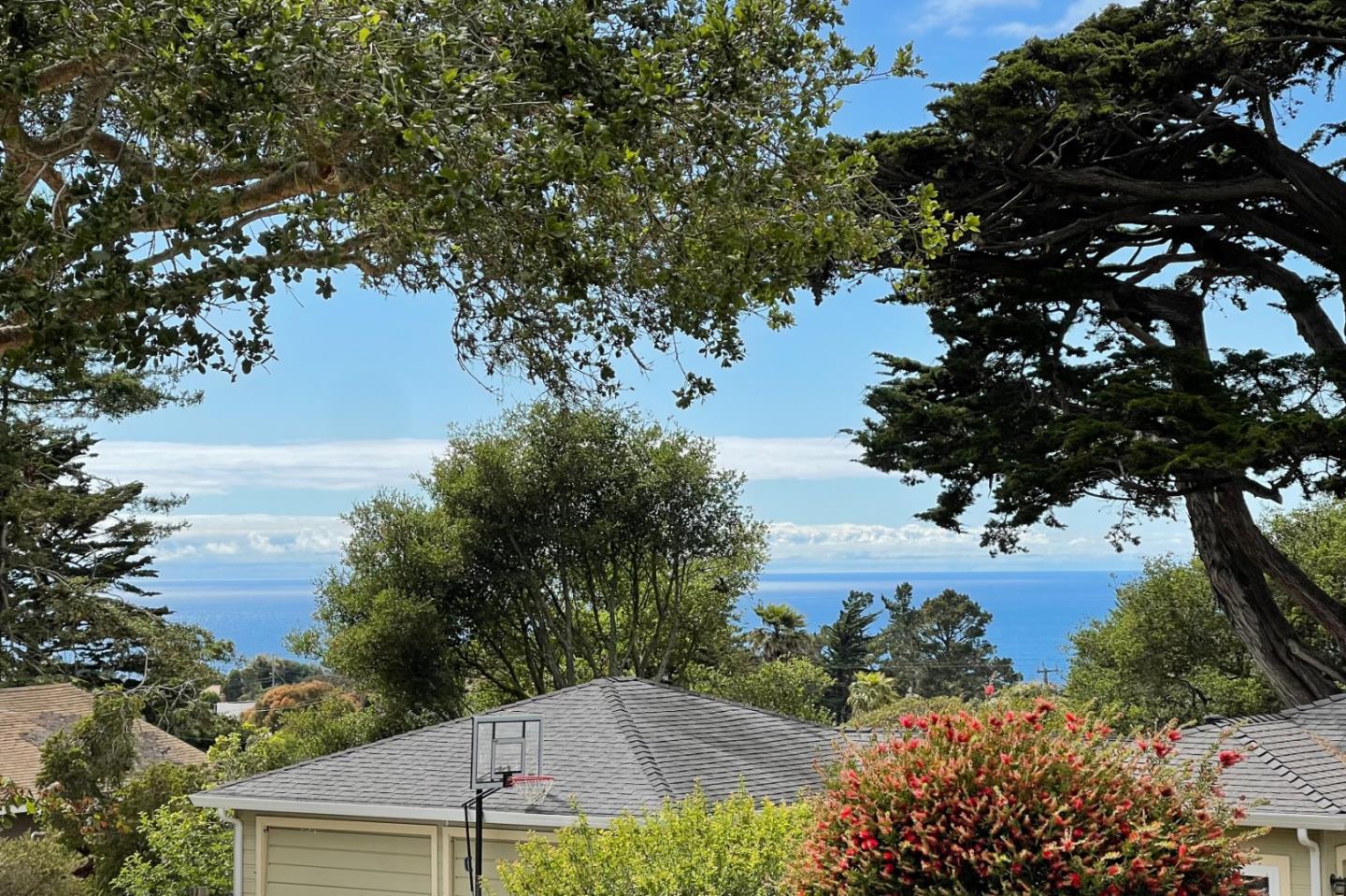305 Stuart Avenue Pacific Grove, CA 93950 - Photo 3 of 24 a view of a lake from a yard
